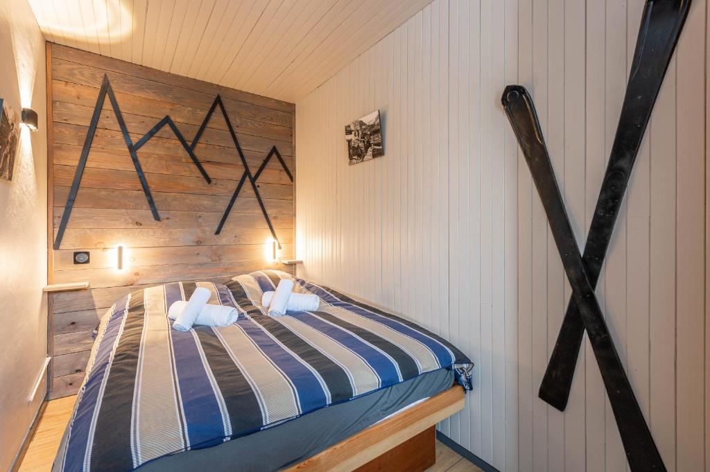 Postel nebo postele na pokoji v ubytování DIFY Grand Soleil - Courchevel 1650