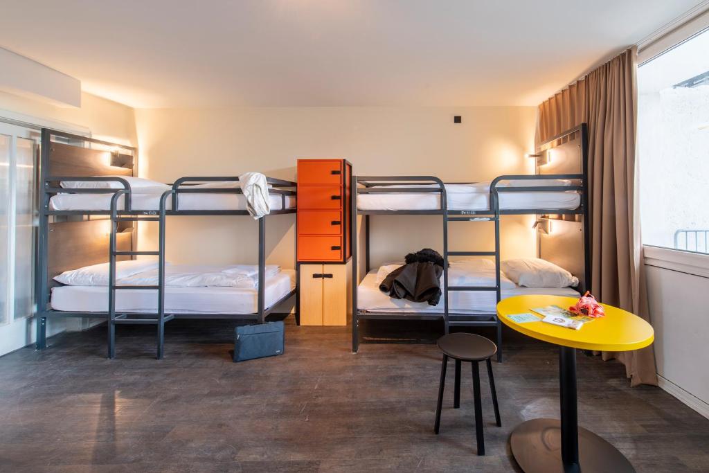 Postel nebo postele na pokoji v ubytování MEININGER Hotel München Zentrum