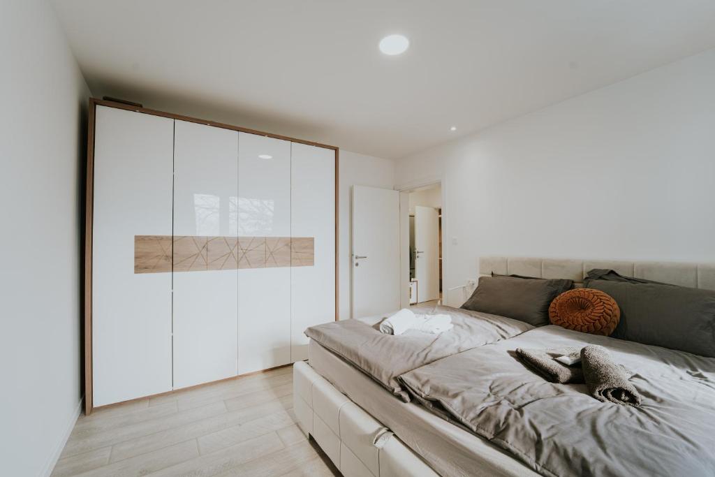 Ένα ή περισσότερα κρεβάτια σε δωμάτιο στο Dila Apartment