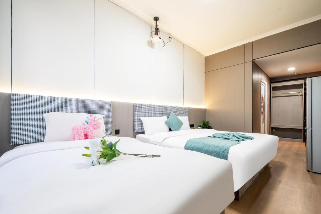 Xi'an Yongning Apartment Hotel客房内的一张或多张床位