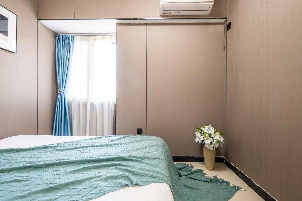 Xi'an Yongning Apartment Hotel客房内的一张或多张床位