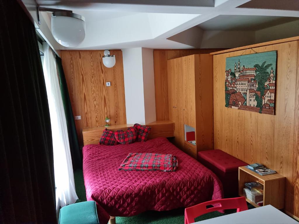 Postel nebo postele na pokoji v ubytování Appartamento Cinzia Residence Solaria Marilleva 1400