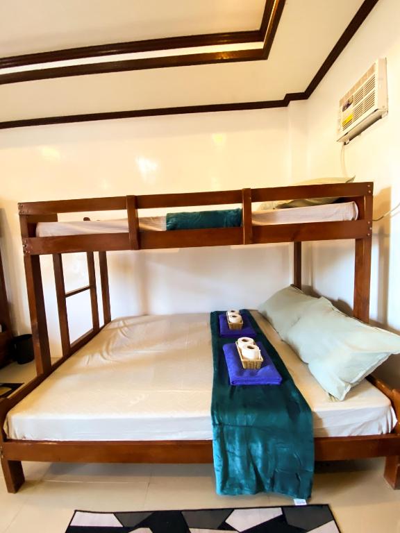 Postel nebo postele na pokoji v ubytování Hapitanan Hostel Siargao