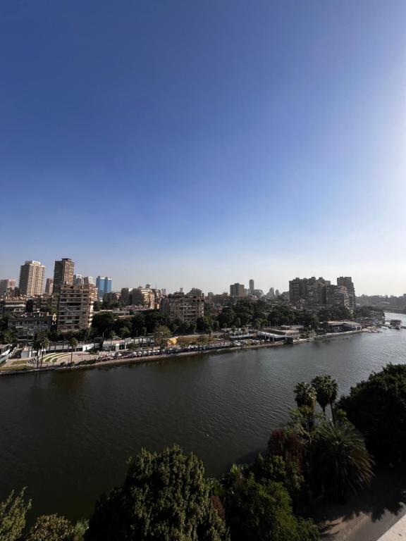 a view of a river with a city in the background at شقة بإطلالة مميزة علي النيل in Cairo