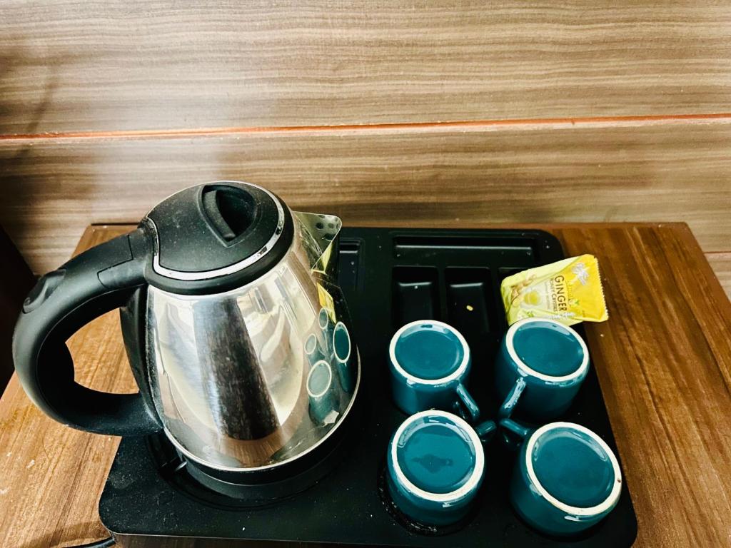 Příslušenství pro přípravu čaje a kávy v ubytování Hotel Jothi