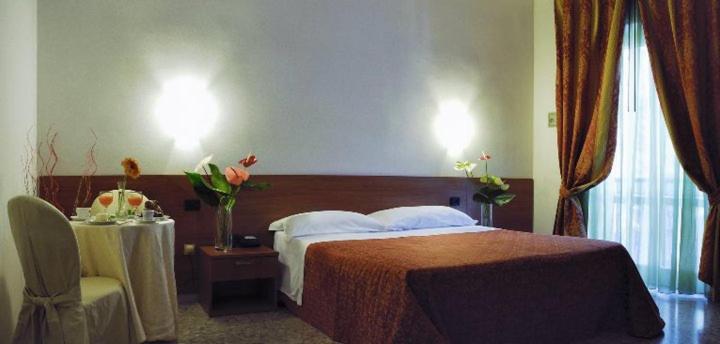 Postel nebo postele na pokoji v ubytování Hotel Villa Giusy