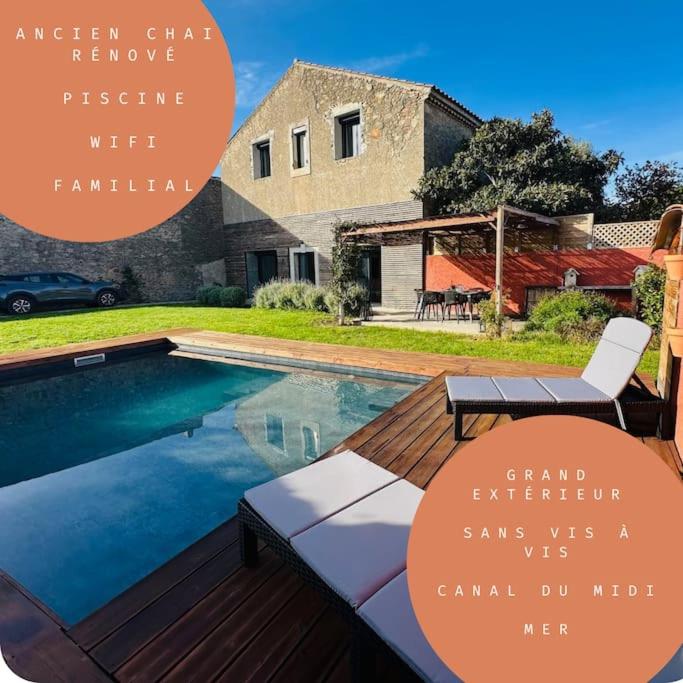 une piscine devant une maison dans l'établissement Ancien chai rénové avec piscine, à Paraza