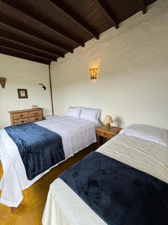 Postel nebo postele na pokoji v ubytování Cachoeira e Pousada Paraíso dos Pândavas