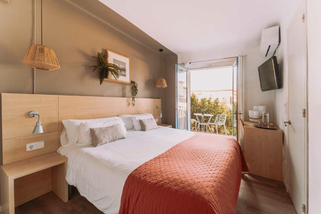 Postel nebo postele na pokoji v ubytování Hotel Bell Repos