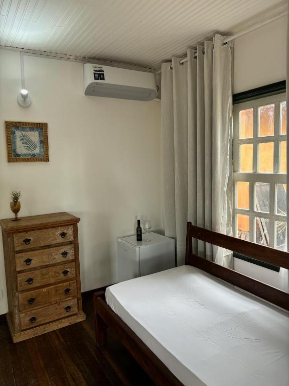 Postel nebo postele na pokoji v ubytování Cachoeira e Pousada Paraíso dos Pândavas