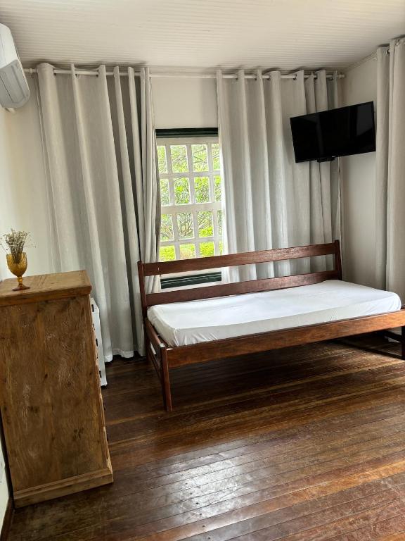 Postel nebo postele na pokoji v ubytování Cachoeira e Pousada Paraíso dos Pândavas