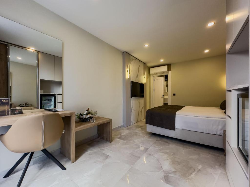 TV a/nebo společenská místnost v ubytování Quality Gold Suite Hotel