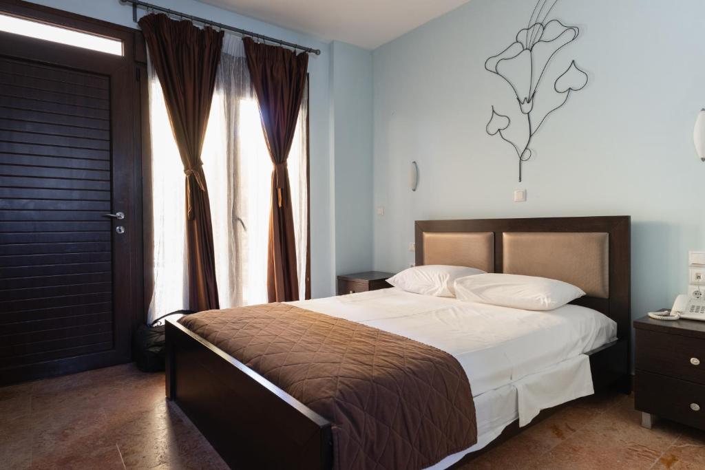 Postel nebo postele na pokoji v ubytování Hotel Makednos