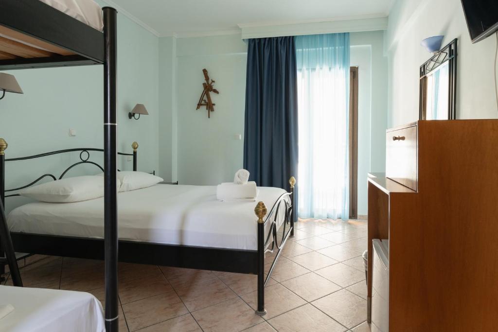 Postel nebo postele na pokoji v ubytování Hotel Makednos