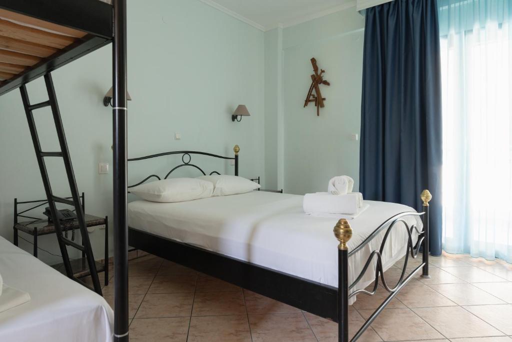 Postel nebo postele na pokoji v ubytování Hotel Makednos