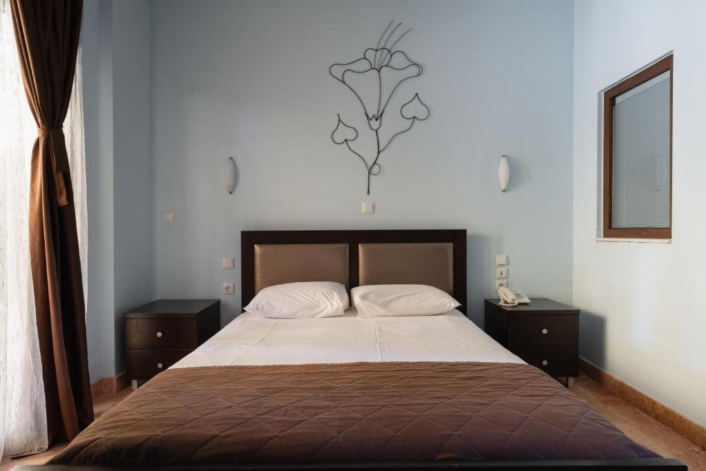 Postel nebo postele na pokoji v ubytování Hotel Makednos