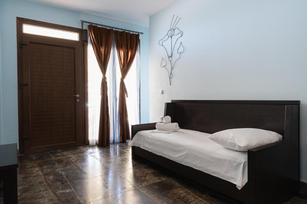 Postel nebo postele na pokoji v ubytování Hotel Makednos