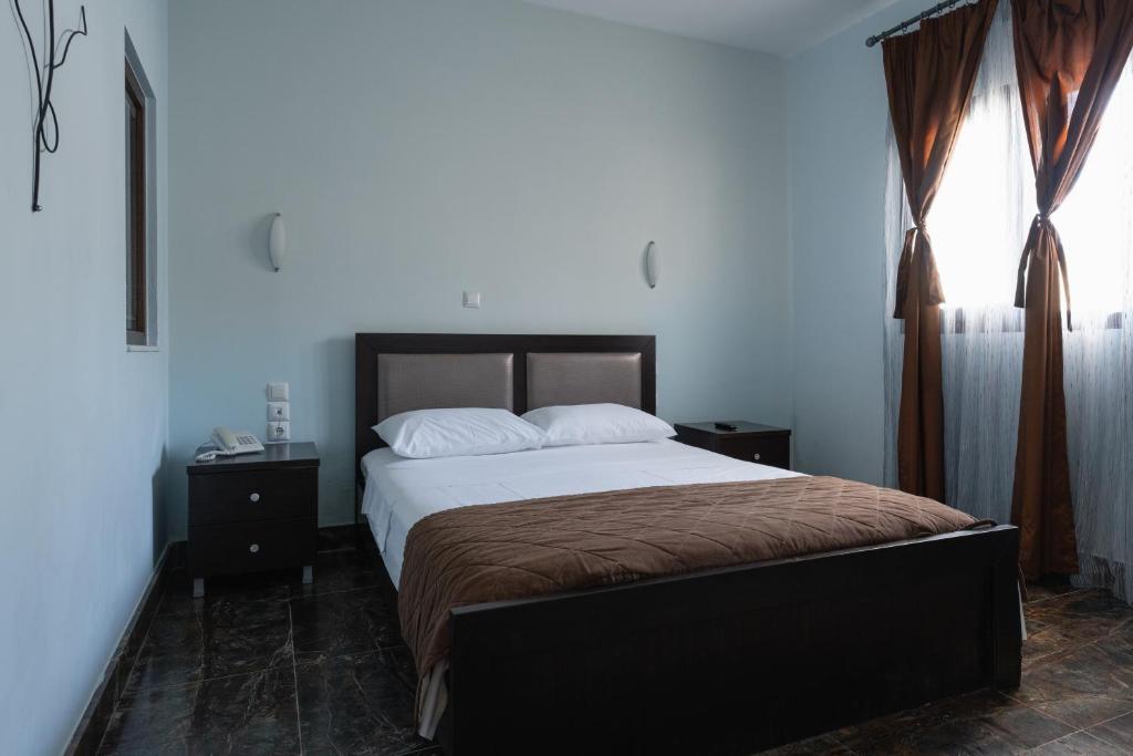 Postel nebo postele na pokoji v ubytování Hotel Makednos
