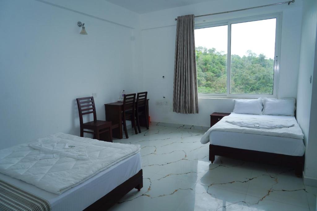 Postel nebo postele na pokoji v ubytování Pinnacle Resort Vagamon