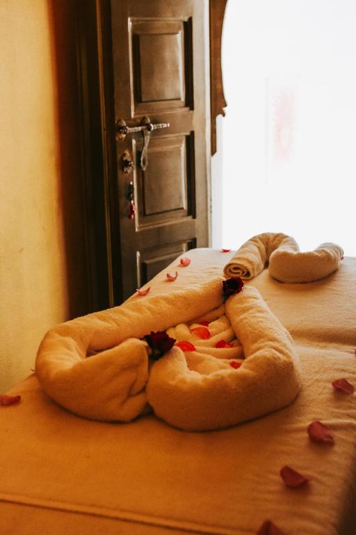 Postel nebo postele na pokoji v ubytování RIAD NOLITA & SPA Kasbah