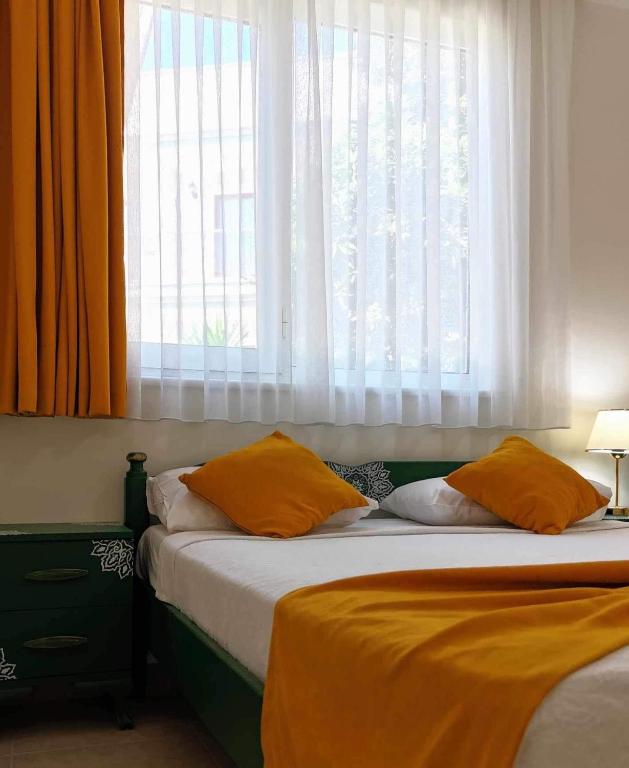 Postel nebo postele na pokoji v ubytování Yazıcı Otel Bozburun