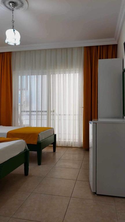 Postel nebo postele na pokoji v ubytování Yazıcı Otel Bozburun