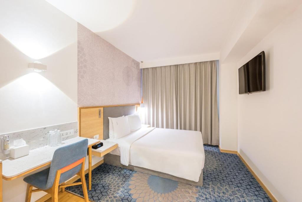 Postel nebo postele na pokoji v ubytování Holiday Inn Express Greater Noida Knowledge Park by IHG