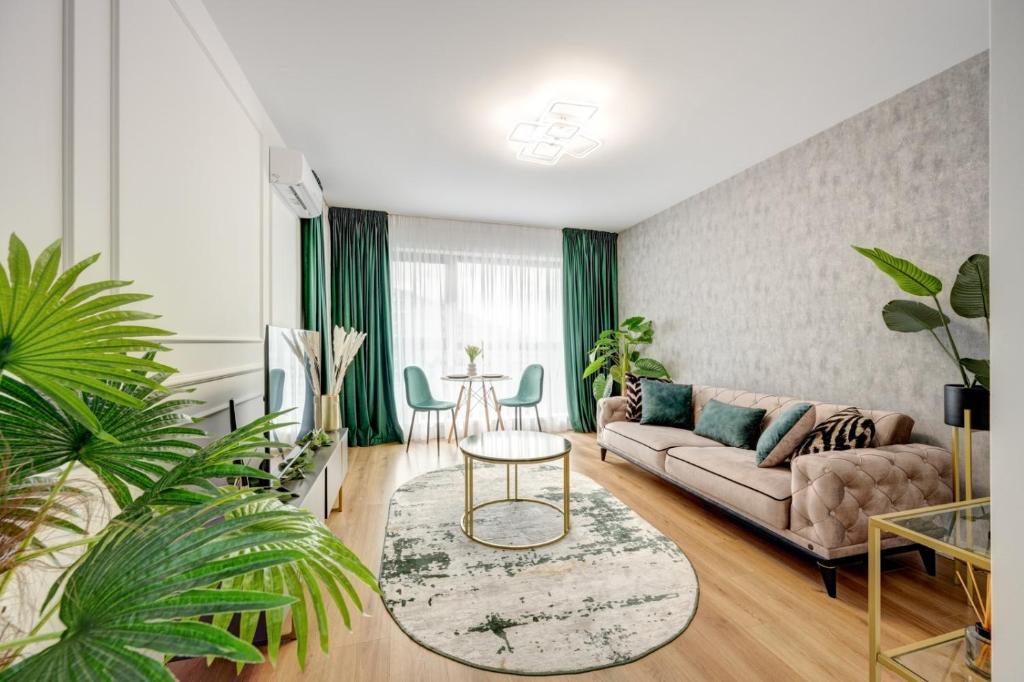 a living room with a couch and a table at Pipera onix design in Voluntari