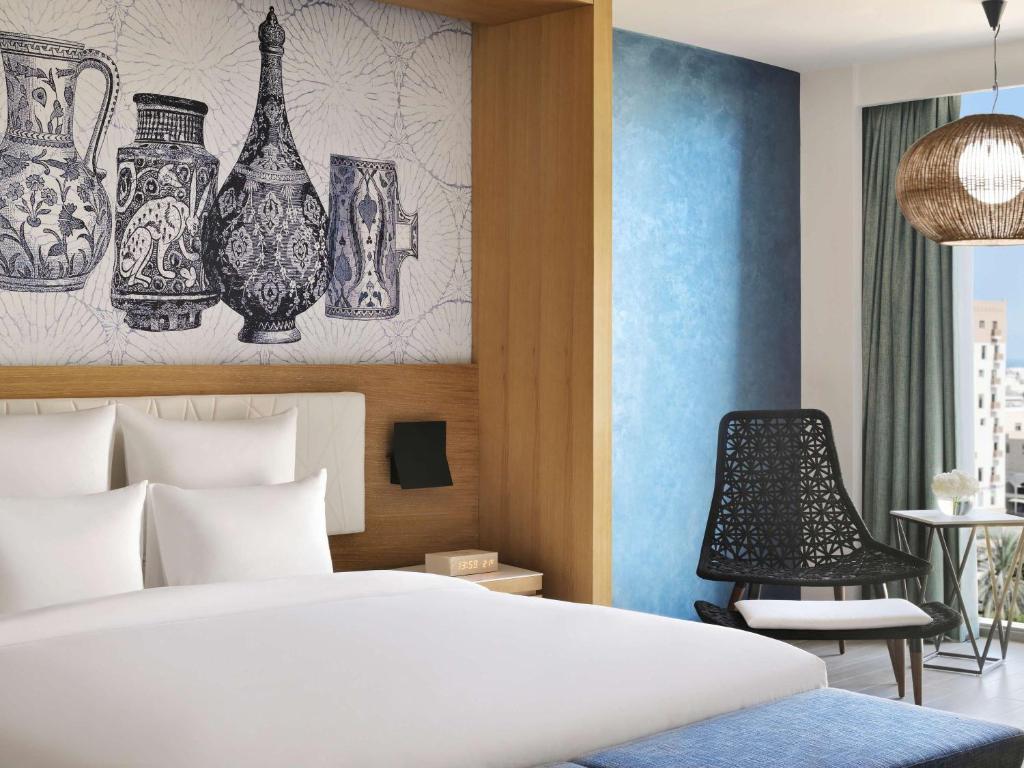 Postel nebo postele na pokoji v ubytování Mövenpick Hotel & Apartments Ghala Muscat