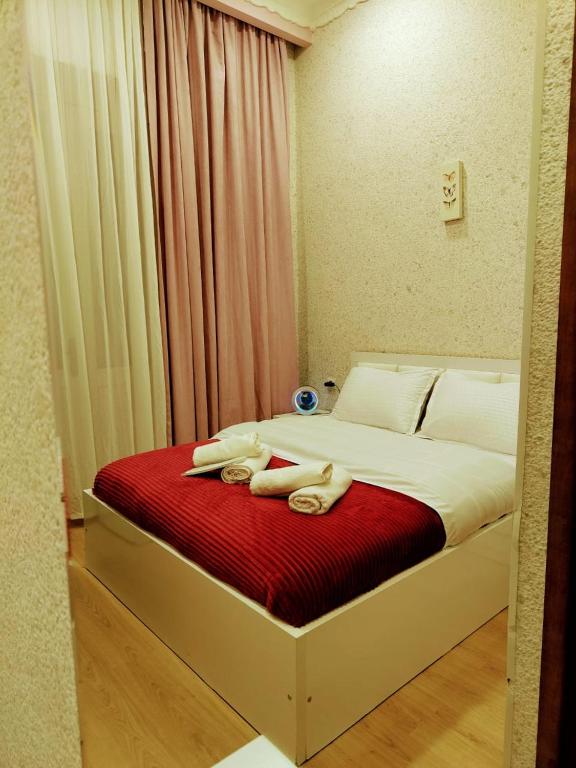 Postel nebo postele na pokoji v ubytování Cozy Rooms Tbilisi