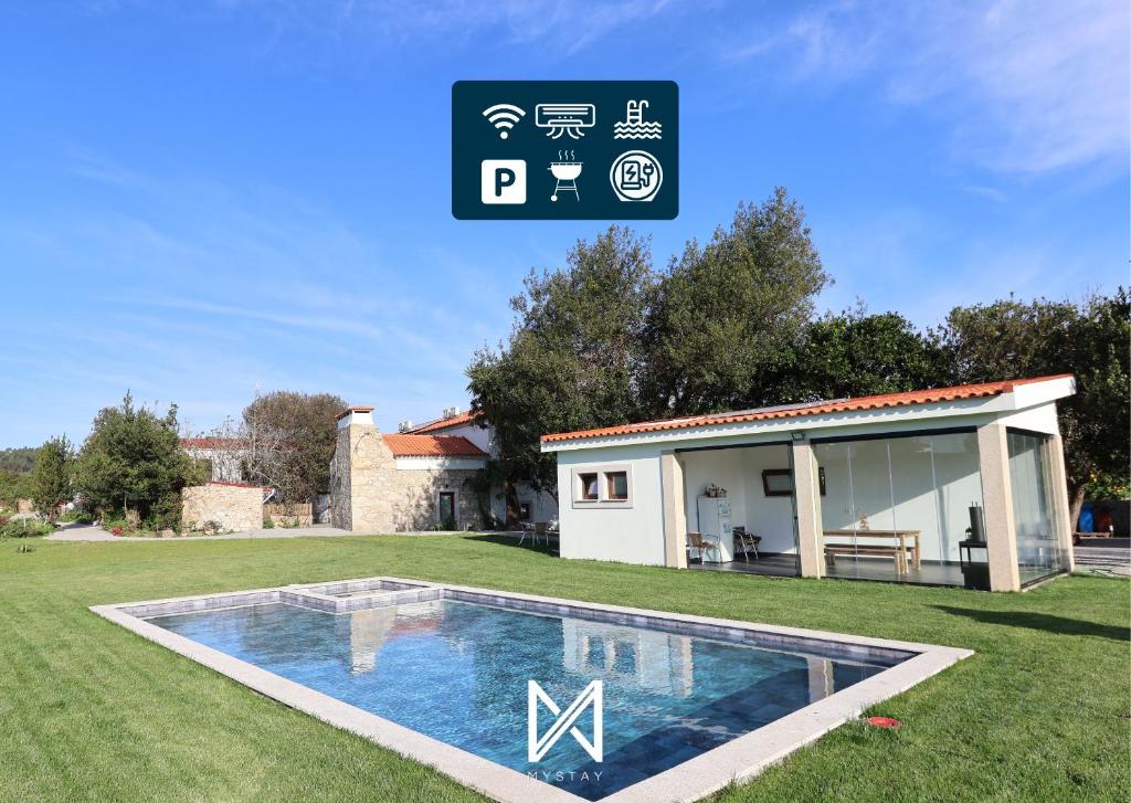 a house with a swimming pool in a yard at MyStay - Quinta das Aromáticas in Malta