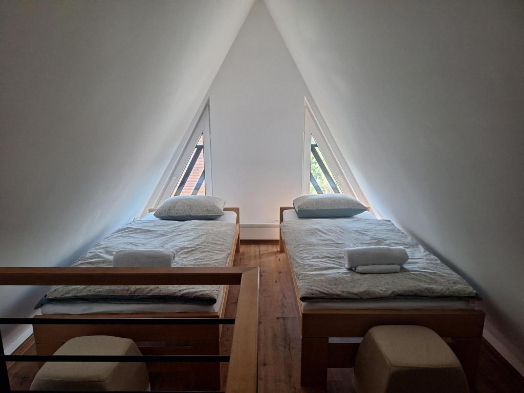 Postel nebo postele na pokoji v ubytování Vila Nada apartments
