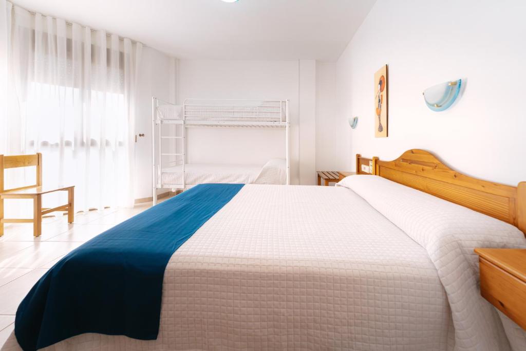 Postel nebo postele na pokoji v ubytování Hotel Rosi