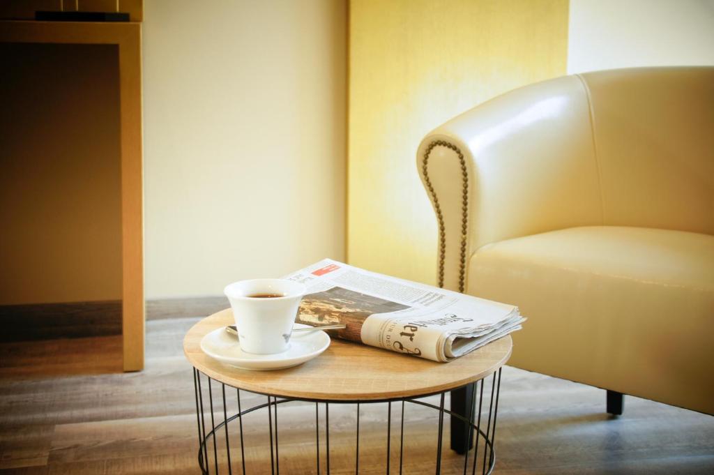Hotel Athen Kelsterbach Frankfurt Airportにあるシーティングエリア
