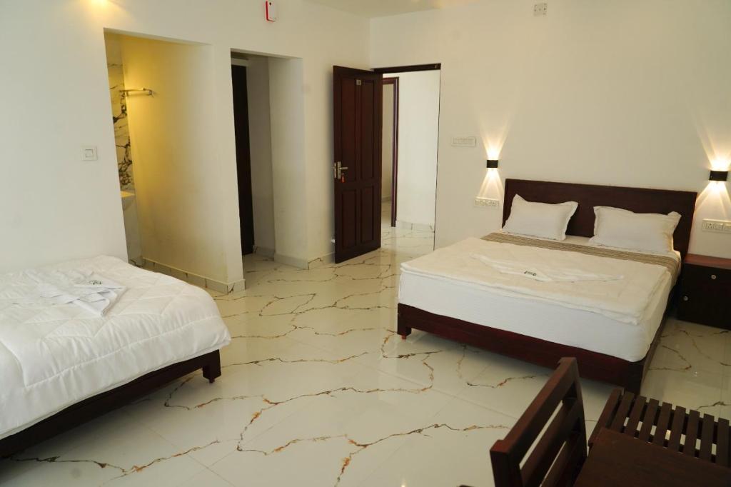 Postel nebo postele na pokoji v ubytování Pinnacle Resort Vagamon