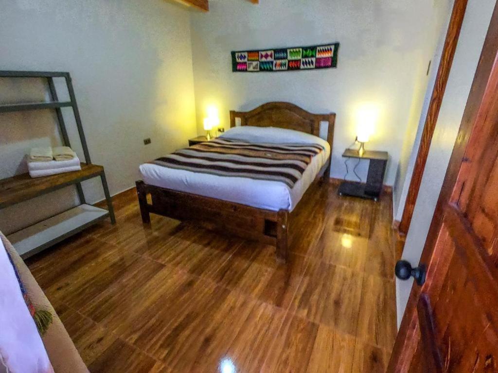Postel nebo postele na pokoji v ubytování Hostal Nuevo Amanecer