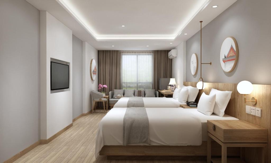 Happy Dragon Saga Hotel whole-house heating Free wifi unlimited for westen software and fluent English speaking,Tourist ticket service&food recommendation,Near Tian'AnMen Forbidden City,Wangfujing walking street,Easy to get any tour sights by metro - Sala Ejecutiva