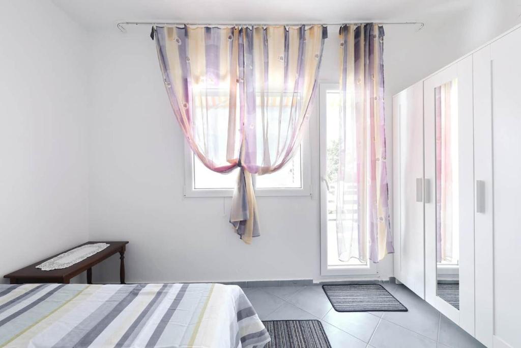Posteľ alebo postele v izbe v ubytovaní Apartments Djurdja