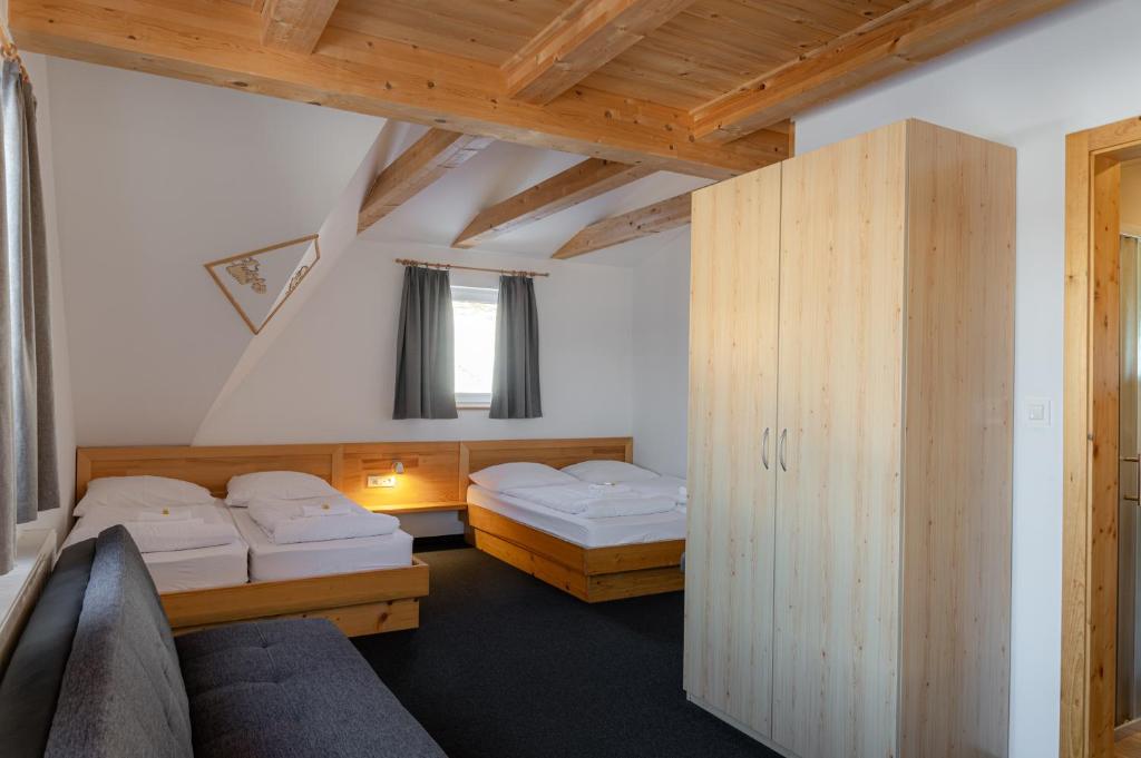 Postel nebo postele na pokoji v ubytování Hotel House Rozka