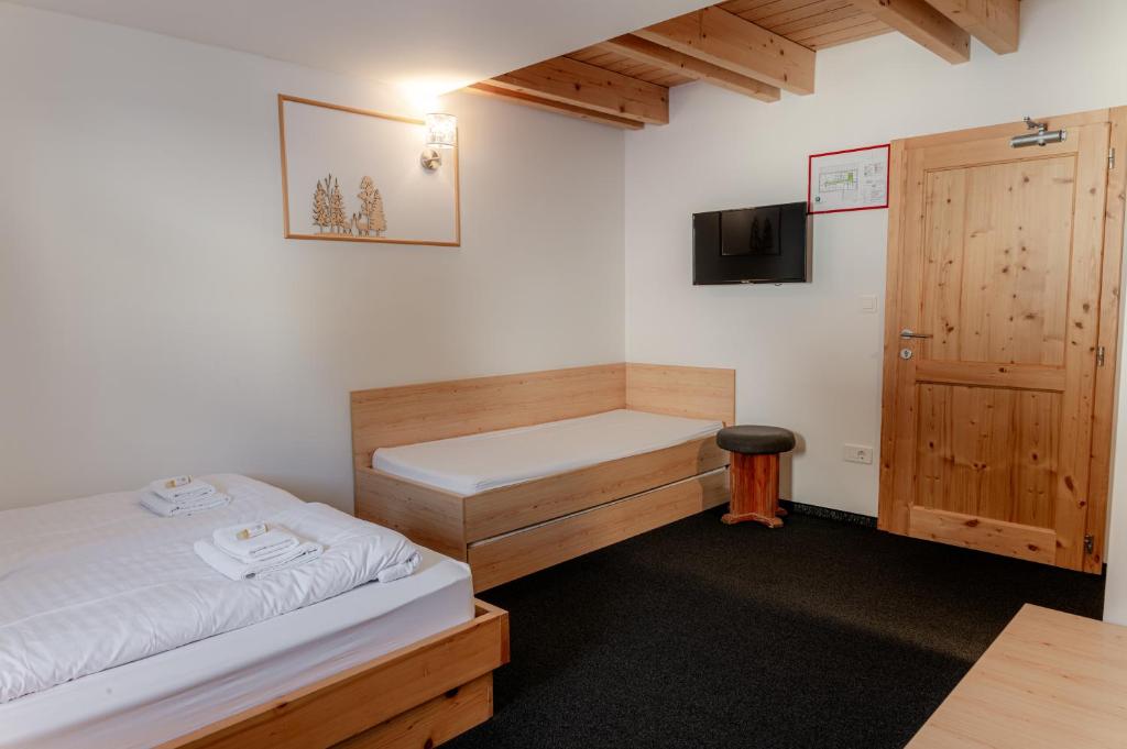 Postel nebo postele na pokoji v ubytování Hotel House Rozka