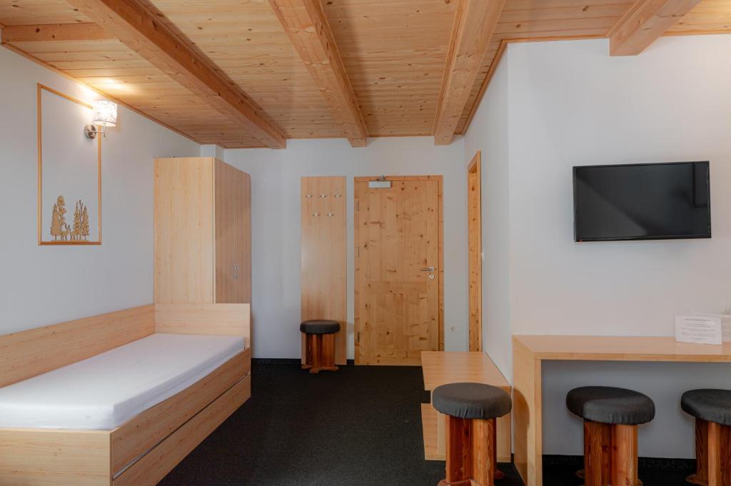 Postel nebo postele na pokoji v ubytování Hotel House Rozka