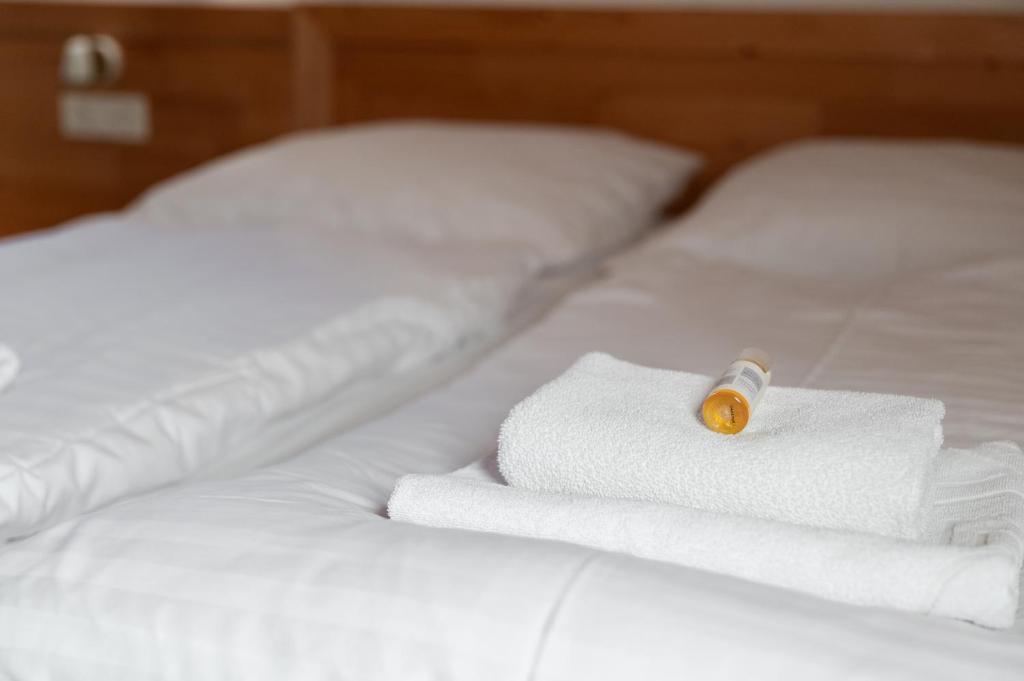 Postel nebo postele na pokoji v ubytování Hotel House Rozka
