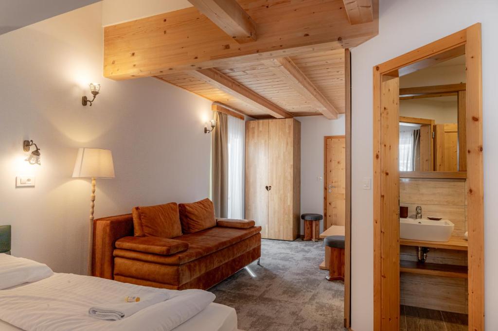 Postel nebo postele na pokoji v ubytování Hotel House Rozka