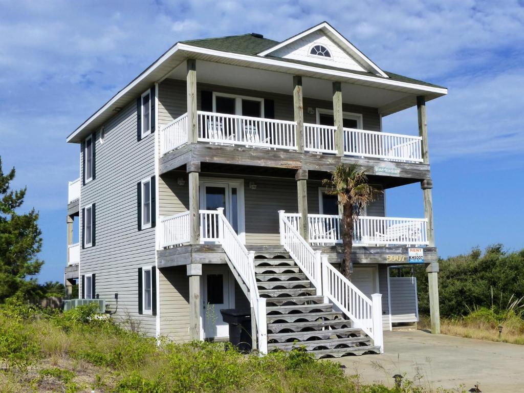 a large house with stairs leading up to it at KH5007- Fore Sea Suns in Kitty Hawk