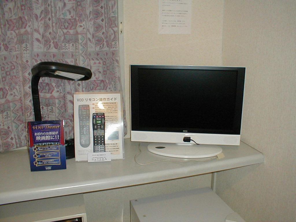 TV a/nebo společenská místnost v ubytování Business Hotel Chateau Est Takamatsu