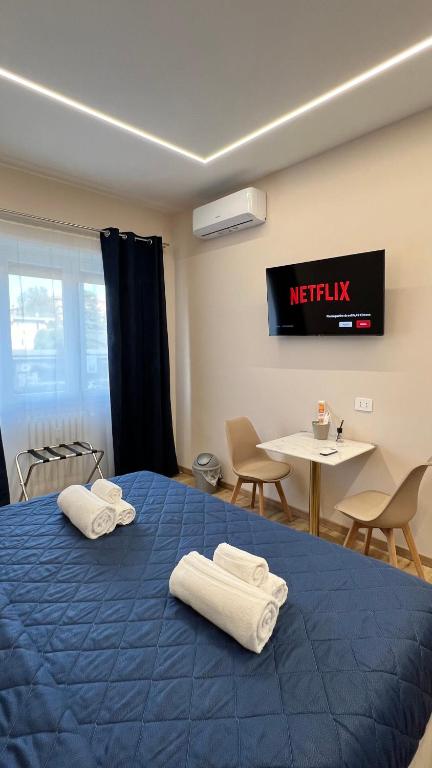 Postel nebo postele na pokoji v ubytování Raffaelli Suite