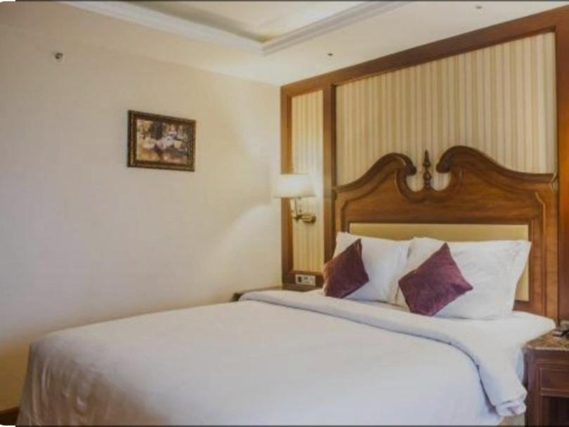 Giường trong phòng chung tại SMS GRAND inn