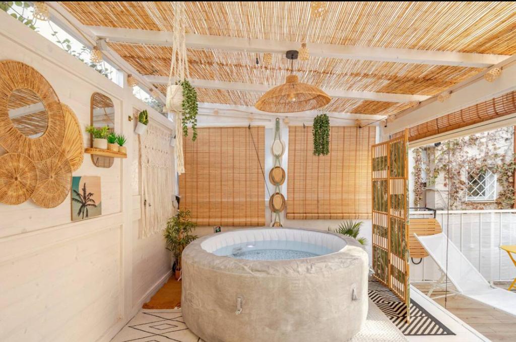 a large bathroom with a large tub in a room at Vita lenta Roma Pigneto terrazza in Rome