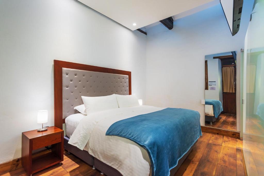 Postel nebo postele na pokoji v ubytování Hotel Boutique MR