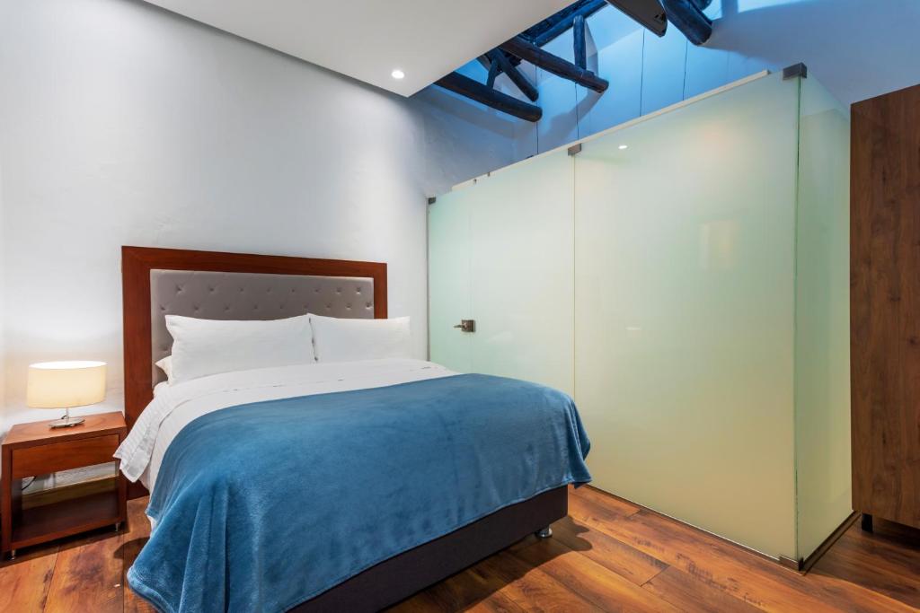 Postel nebo postele na pokoji v ubytování Hotel Boutique MR